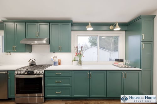 This beautiful Rockville Kitchen features Dura brand cabinets painted in the Benjamin Moore shade, Gondola Ride.